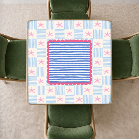 mahjong mat with a colorful retro checkerboard pattern featuring pink starfish, blue stripes, and a central blue-and-pink striped panel
