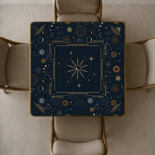 celestial mahjong mat featuring a gold celestial design, including a central compass rose, stars, suns, and moon phases.