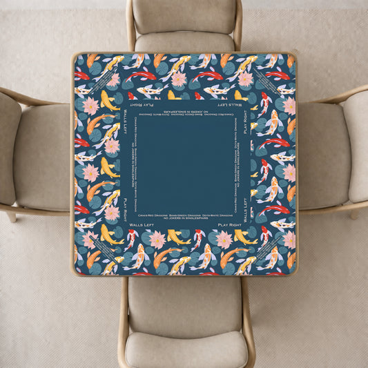 mahjong mat with a dark blue and multicolor koi fish patterned tablecloth,