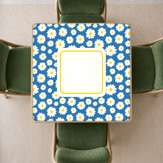 mahjong mat with a blue background and a repeating white daisy pattern, viewed from above.
