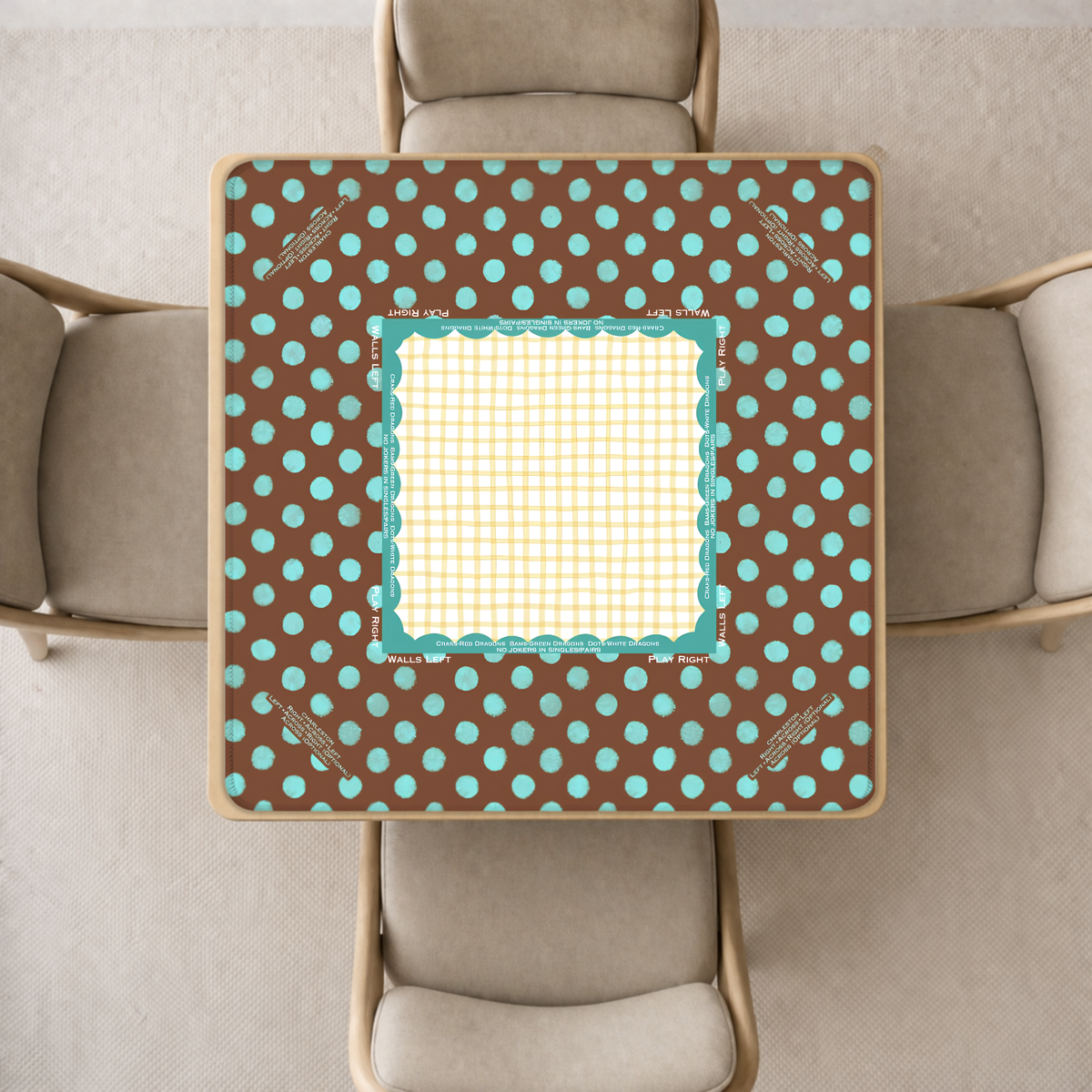 mahjong mat a brown and turquoise polka-dot pattern, surrounded by four beige upholstered chairs in a neutral indoor setting.