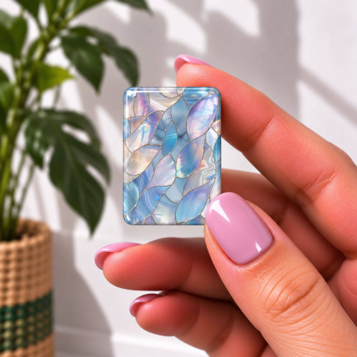 mahjong tile featuring an iridescent abalone shell pattern in shades of blue, lavender, and white