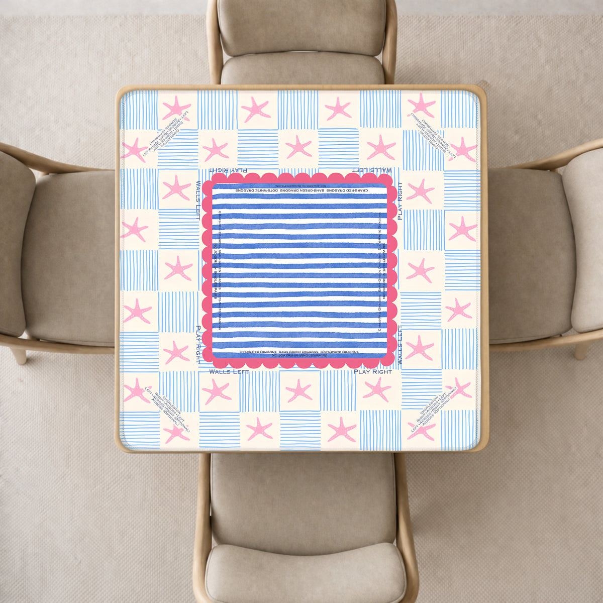 mahjong mat featuring a blue striped center panel, pink scalloped border, and a cream background with blue stars and stripes.