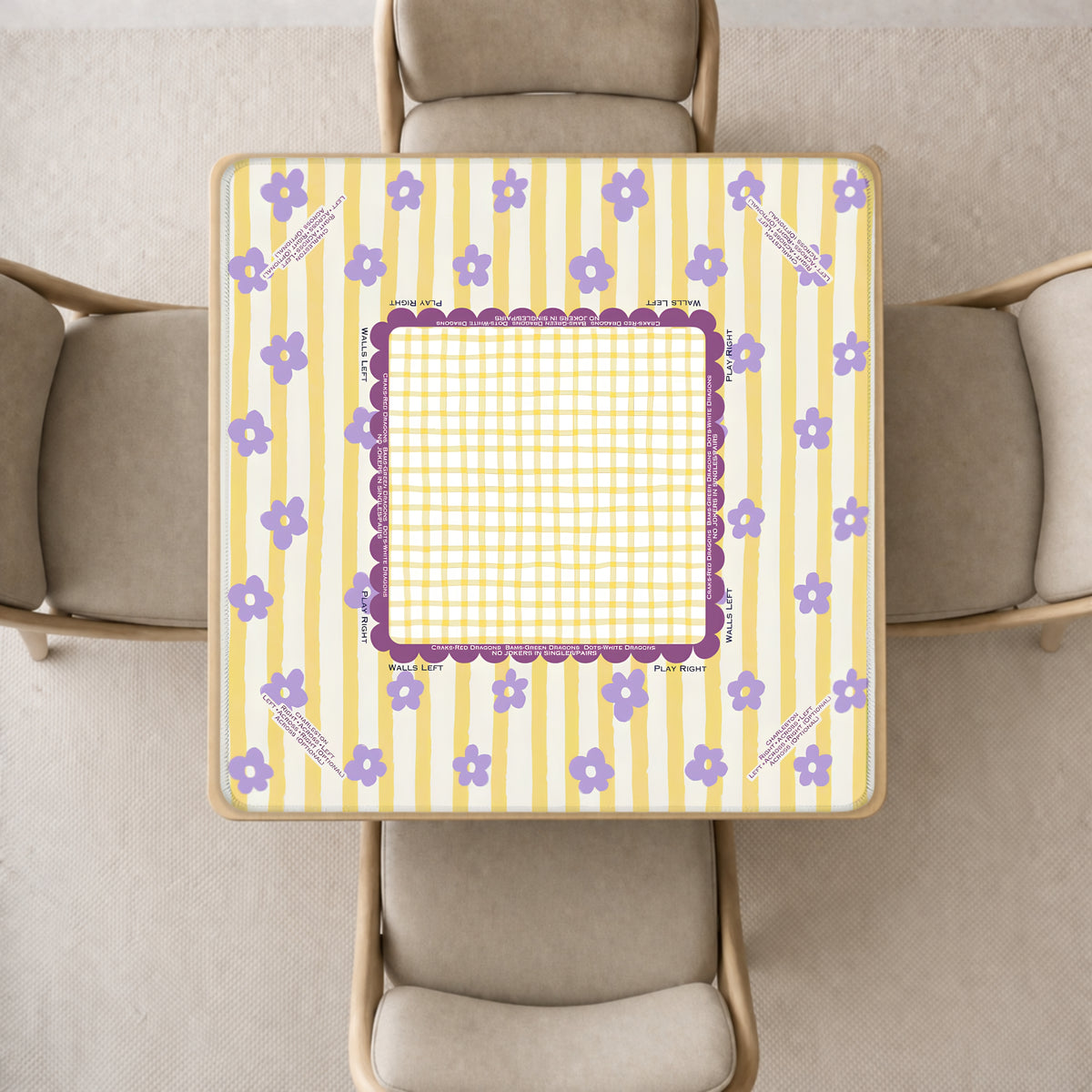 mahjong mat with a yellow and white striped pattern, purple floral accents, and a central purple frame, shown from above